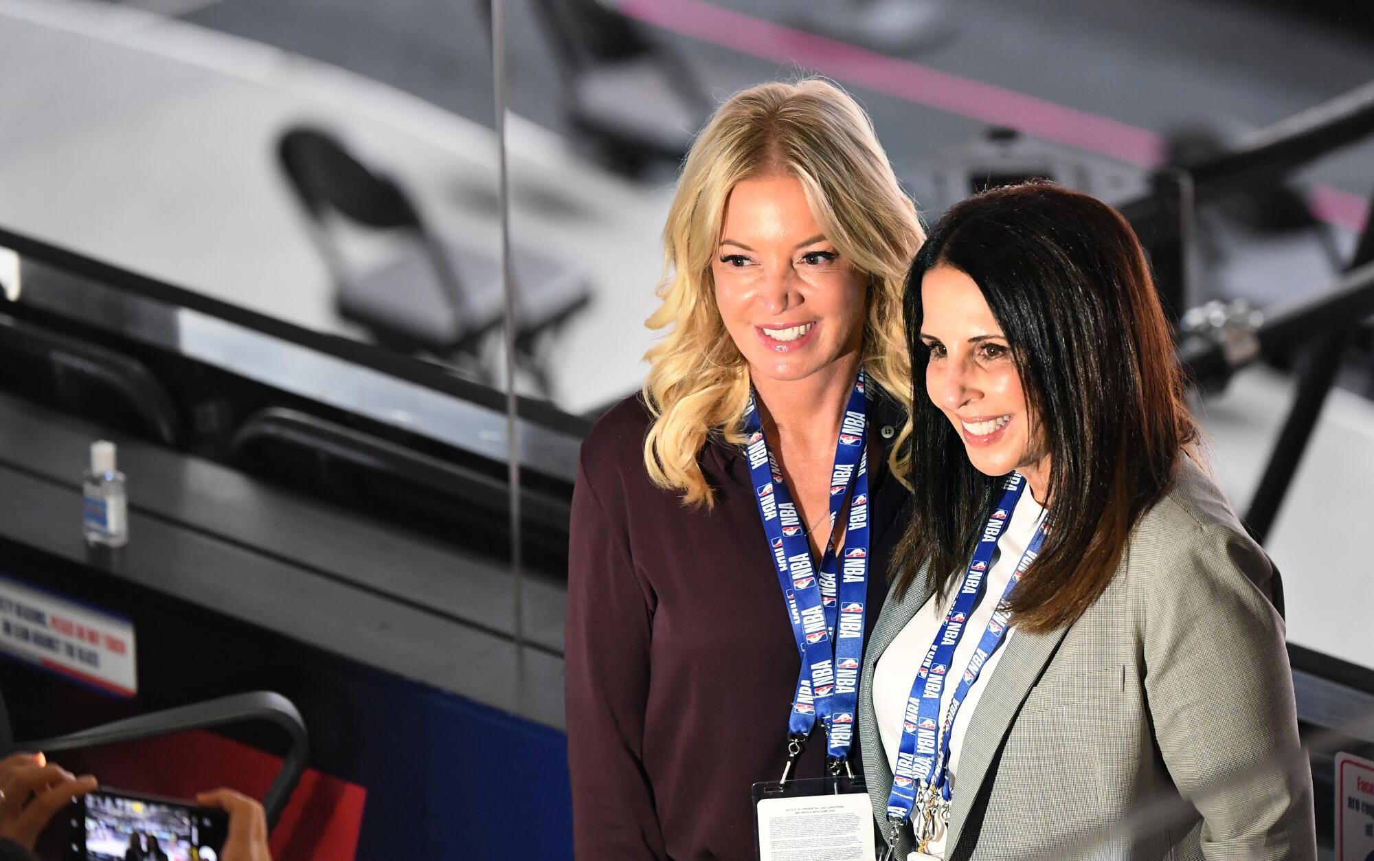  Jeanie Buss and Linda Rambis pose for a photo before Game 2 of the NBA FInals.