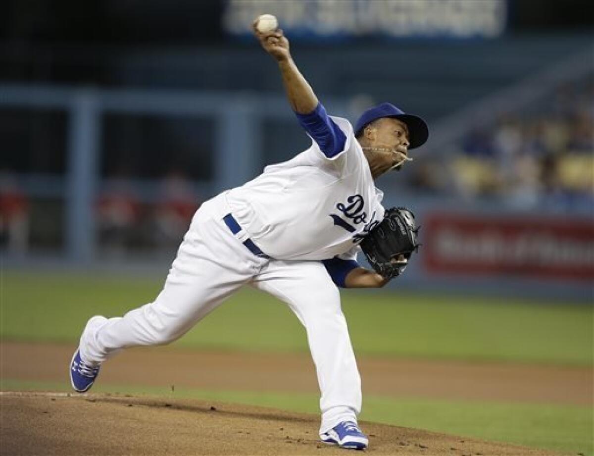 Los Angeles Dodgers starting pitcher Edinson Volquez throws against the Arizona Diamondbacks during the first inning of a baseball game Tuesday, Sept. 10, 2013, in Los Angeles. (AP Photo/Jae C. Hong)
