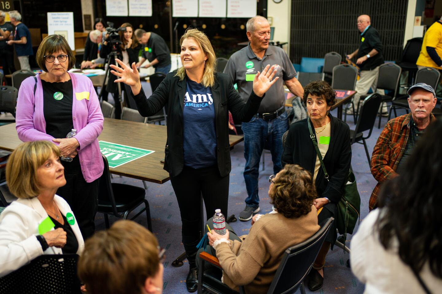 Michelle Nash, a prescient captain for Amy Klobuchar, gathers caucusgoers placing their support behind the Minnesota senator as Iowans gather for a satellite caucus at the Palm Springs Public Library on Monday in Palm Springs.