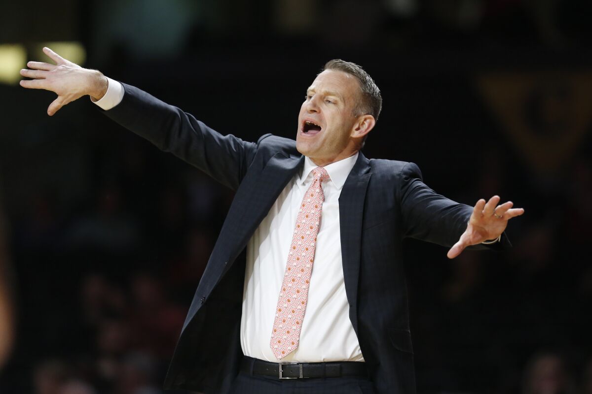 FILE - In this Jan. 22, 2020, file photo, Alabama coach Nate Oats gestures to players during the second half of an NCAA college basketball game against Vanderbilt in Nashville, Tenn. Oats brought points galore in his first season at Alabama with his up-tempo coaching style. Now, he's hoping the defense--and wins--will follow. (AP Photo/Mark Humphrey)