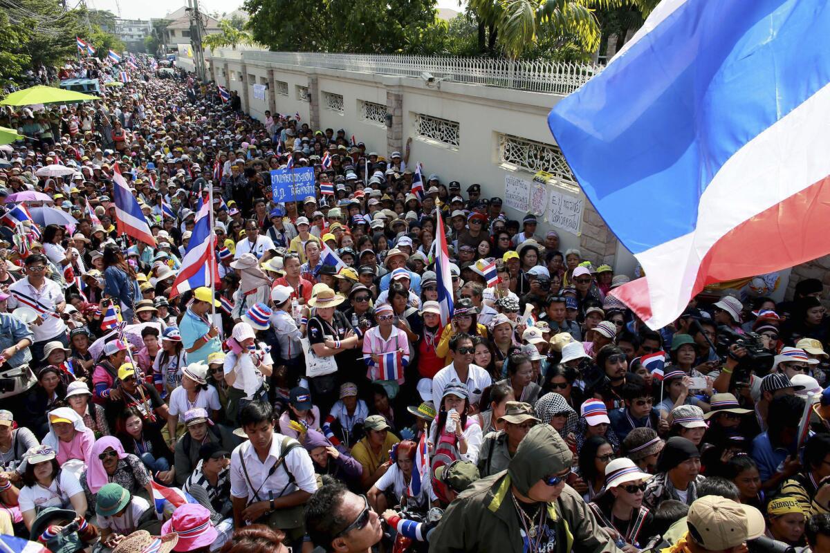 Thai anti-government protesters rally outside Prime Minister Yingluck Shinawatra's Bangkok residence on Sunday. Tens of thousands of protesters are demanding postponement of a Feb. 2 election and that Yingluck step down and let a "people's council" govern until reforms can be enacted.