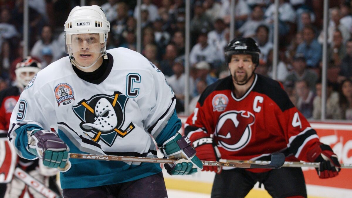 Paul Kariya (9), the Anaheim Mighty Ducks very first draft pick, skates against the New Jersey Devils in game three of the 2003 Stanley Cup Finals.