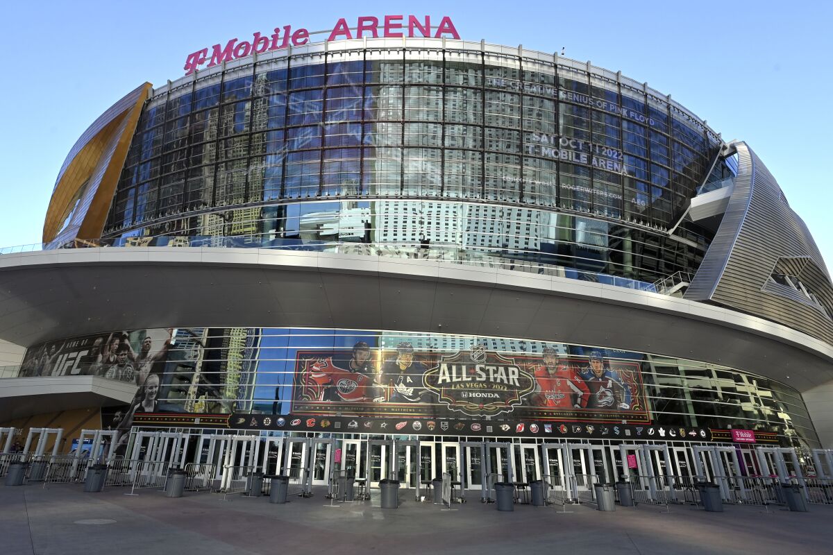 T-Mobile Arena stands in Las Vegas before an NHL hockey game between the Vegas Golden Knights and the Buffalo Sabres on Tuesday, Feb. 1, 2022, in Las Vegas. The arena is the site for this year's NHL All-Star game. (AP Photo/David Becker)