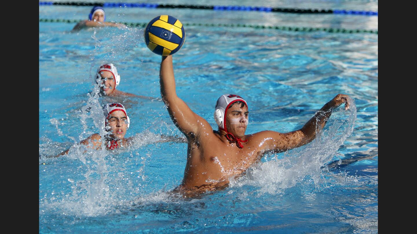 Burroughs High School boys water polo player #3 Marko Vucetic found himself all alone in front of the goal and scored one in away game vs. crosstown rivals Burbank High School, at the Bulldogs pool in Burbank on Wednesday, Oct. 18, 2017.