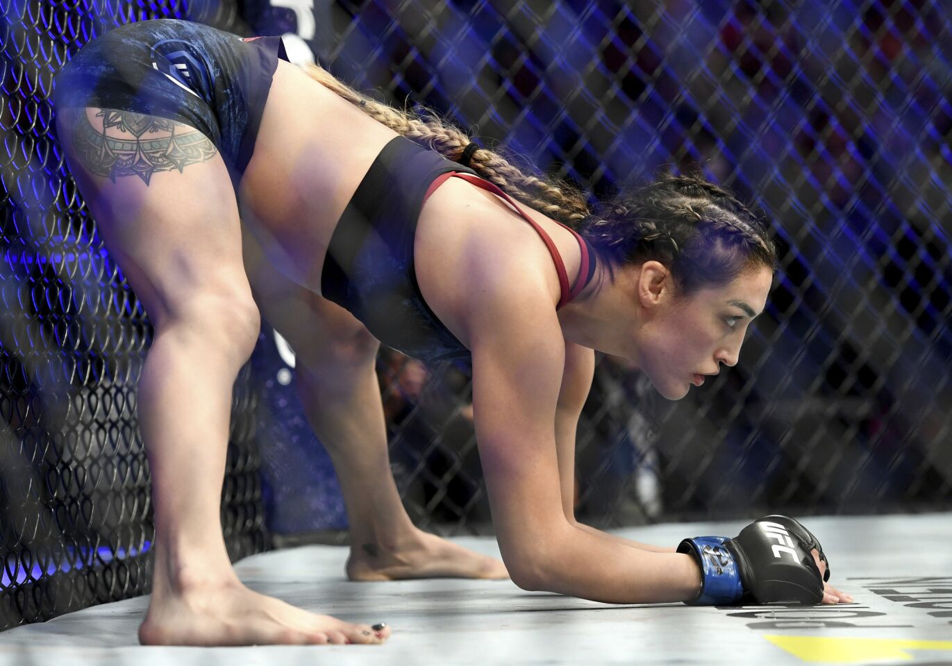 Tatiana Suarez stretches before her strawweight mixed martial arts bout against Carla Esparza at UFC 228 on Saturday, Sept. 8, 2018, in Dallas. (AP Photo/Jeffrey McWhorter)