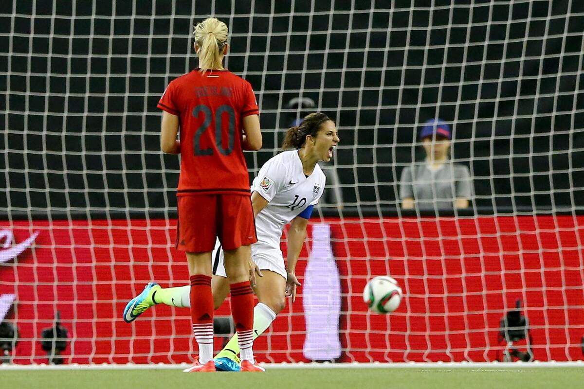 Carli Lloyd of the United States reacts after scoring against Germany on a penalty kick during the 69th minute of a semifinal match of the Women's World Cup.