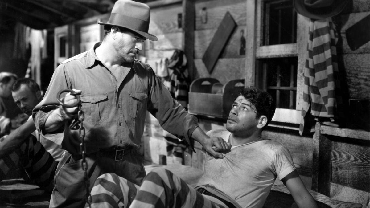 Actor Paul Muni (right) in a scene from the 1932 film "I Am A Fugitive From A Chain Gang."