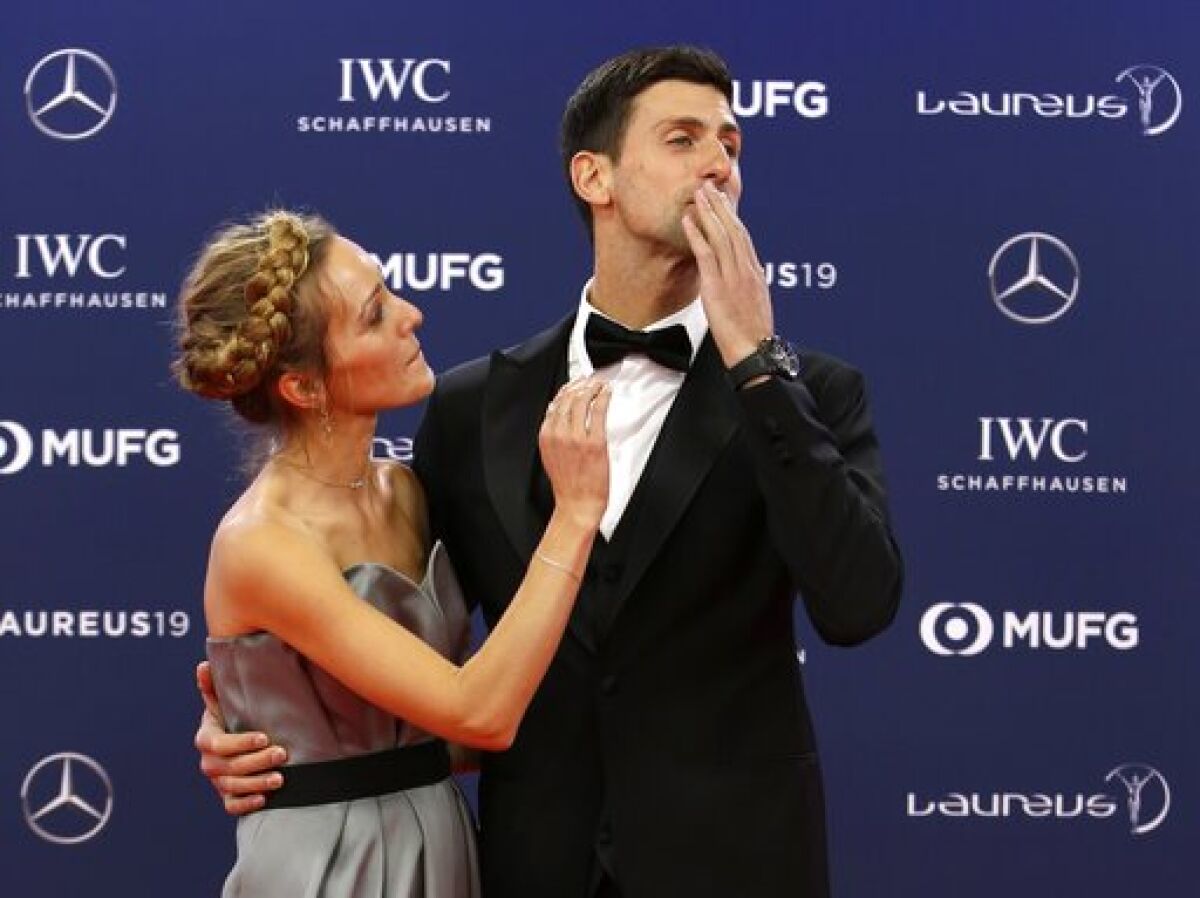 FILE - In this Monday, Feb. 18, 2019 file photo Serbian tennis player Novak Djokovic and his wife Jelena arrive for the 2019 Laureus World Sports Awards. Novak Djokovic has tested positive for the coronavirus after taking part in a tennis exhibition series he organized in Serbia and Croatia. The top-ranked Serb is the fourth player to test positive for the virus after first playing in Belgrade and then again last weekend in Zadar, Croatia. His wife also tested positive. (AP Photo/Claude Paris, File)