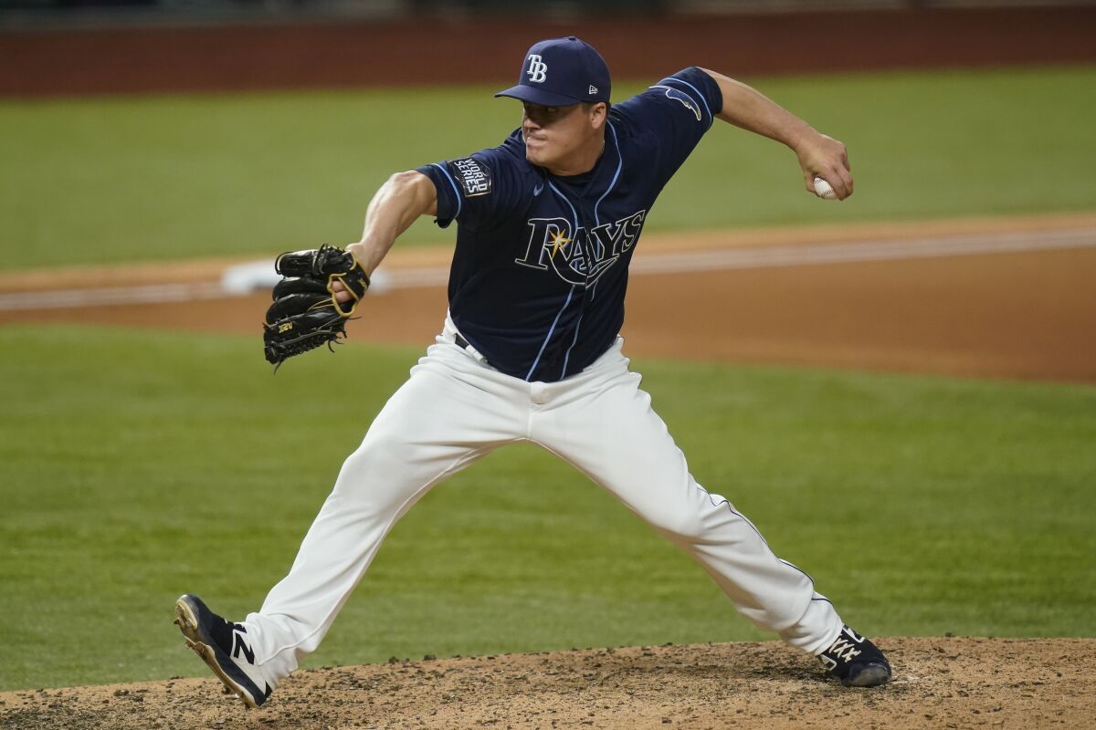 Tampa Bay Rays relief pitcher Aaron Loup throws against the Dodgers in the seventh inning.
