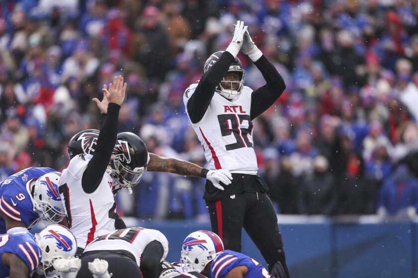 Atlanta Falcons outside linebacker Adetokunbo Ogundeji (92) celebrates after the team scored on a safety during the first half of an NFL football game against the Buffalo Bills, Sunday, Jan. 2, 2022, in Orchard Park, N.Y. (AP Photo/Joshua Bessex)