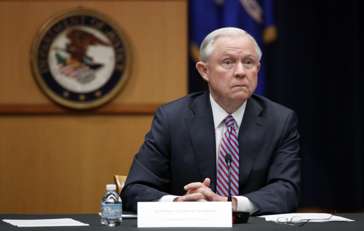 Attorney General Jeff Sessions listens at the Justice Department in Washington on April 18, 2017. Sessions said in a department memorandum on May 22 that the department may "tailor grants to promote a lawful system of immigration." That suggests officials could seek ways to withhold money from communities that refuse to honor detainer requests from federal immigration authorities.