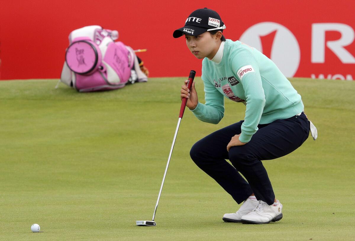 South Korea's Hyo-Joo Kim eyes a shot on the 18th green during the first round of the Women's British Open Golf Championships in Scotland.