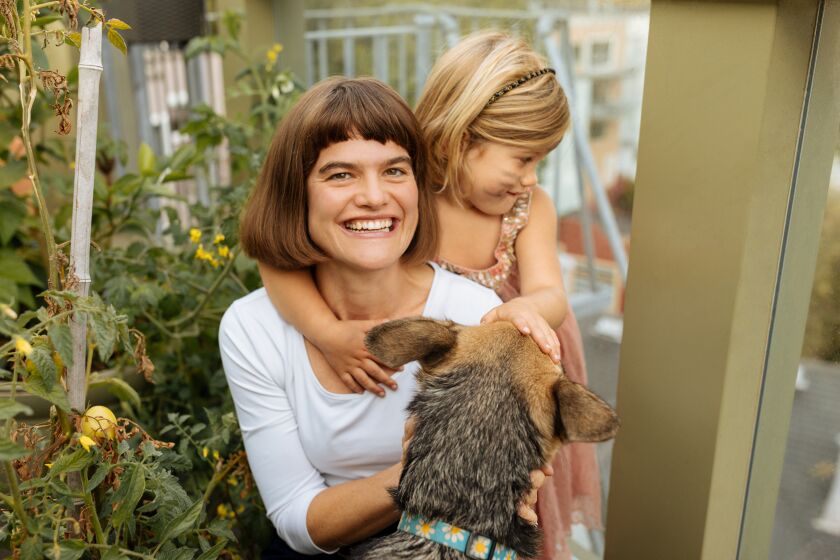 Author Michaeleen Doucleff with her daughter Rosy and their shepherd, Mango, at home in San Francisco. 
