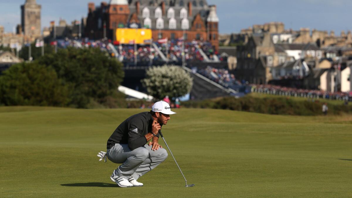 Dustin Johnson lines up his putt on the 16th green during the second round of the British Open at St. Andrews, Scotland, on Saturday.