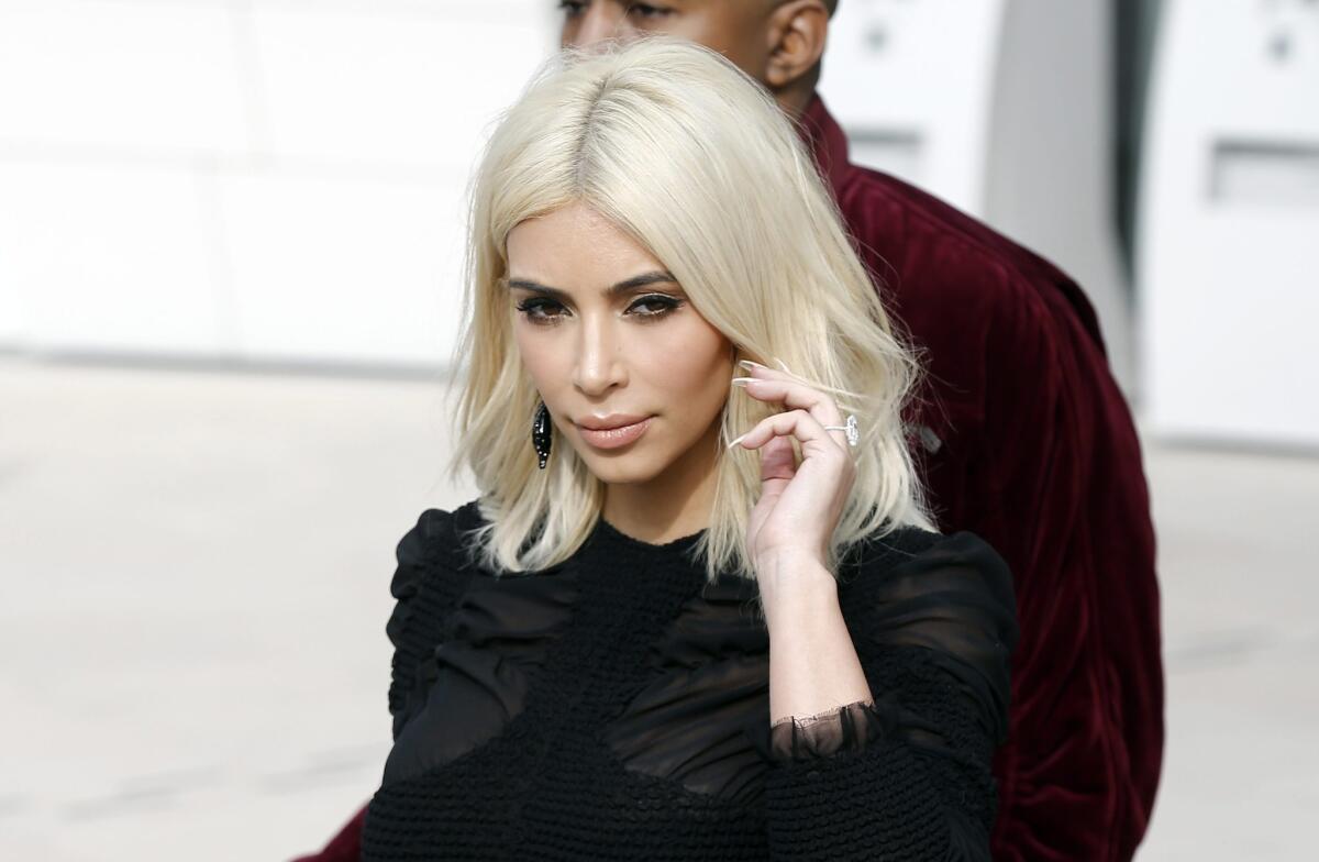 Kim Kardashian, seen during Paris Fashion Week this month, got her platinum blond look from celebrity hair colorist Lorri Goddard.