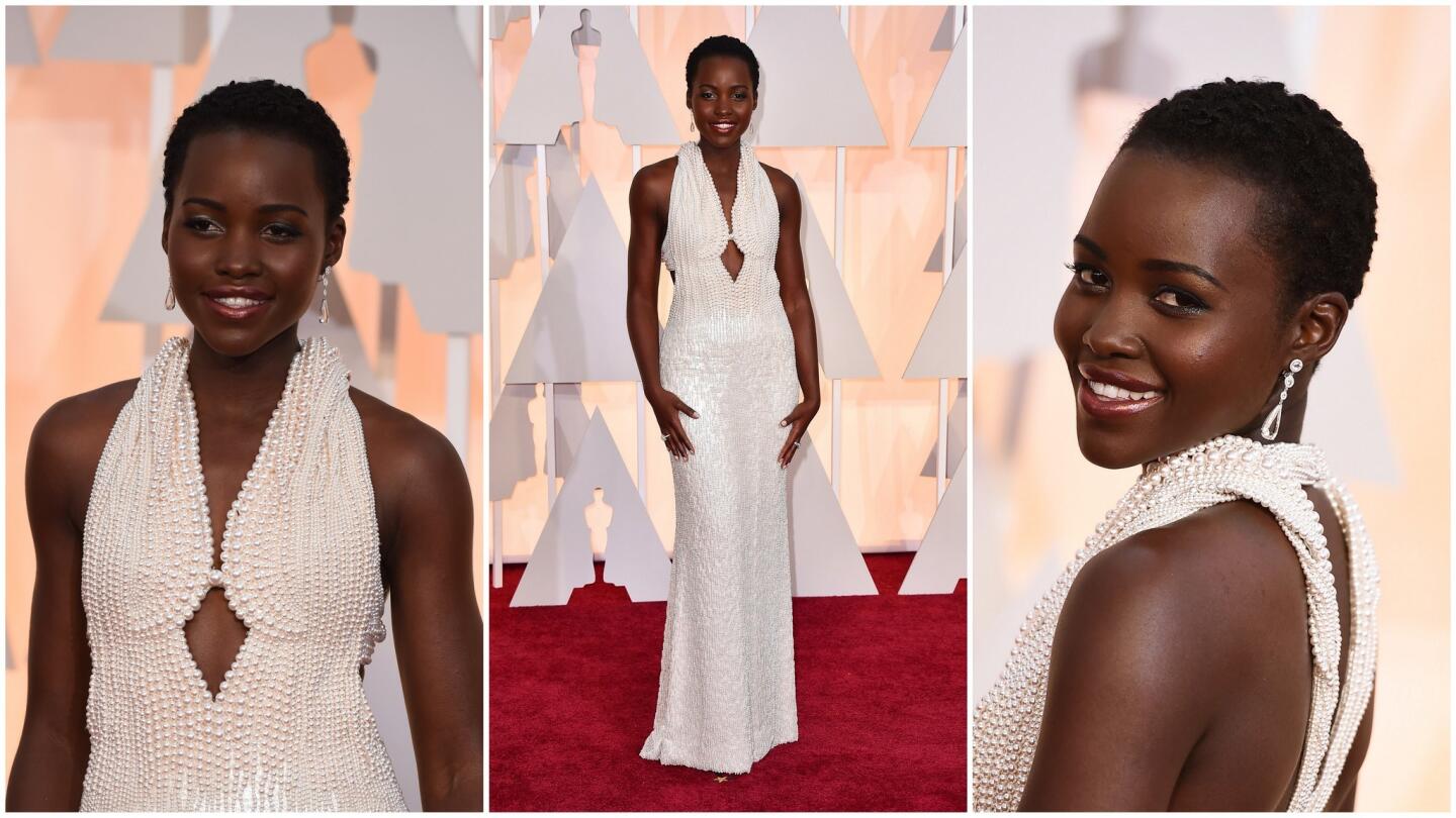 Lupita Nyong'o in Francisco Costa for Calvin Klein. How can you not be impressed by the workmanship on this pearl-palooza? The halter gown is embroidered with 6,000 pearls in 5 different sizes, just try counting them.