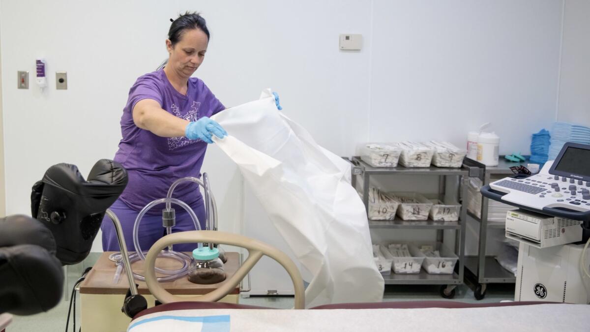 A medical assistant prepares an operating room for patients at a women's health clinic in Granite City, Ill. A new study reports that women who were denied an abortion had worse health five years later compared with women who had the procedure.