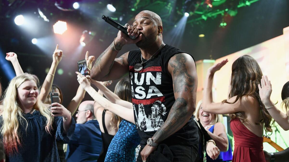 Flo Rida performs onstage at the 25th annual Race to Erase MS gala at the Beverly Hilton Hotel in Beverly Hills on Saturday.