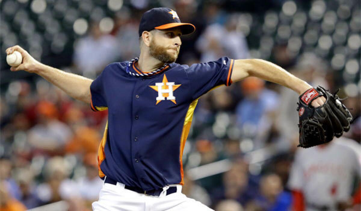 Houston's Scott Feldman appeared to be taking his time in delivering pitches to Angels batters Sunday during a 7-4 Astros victory.