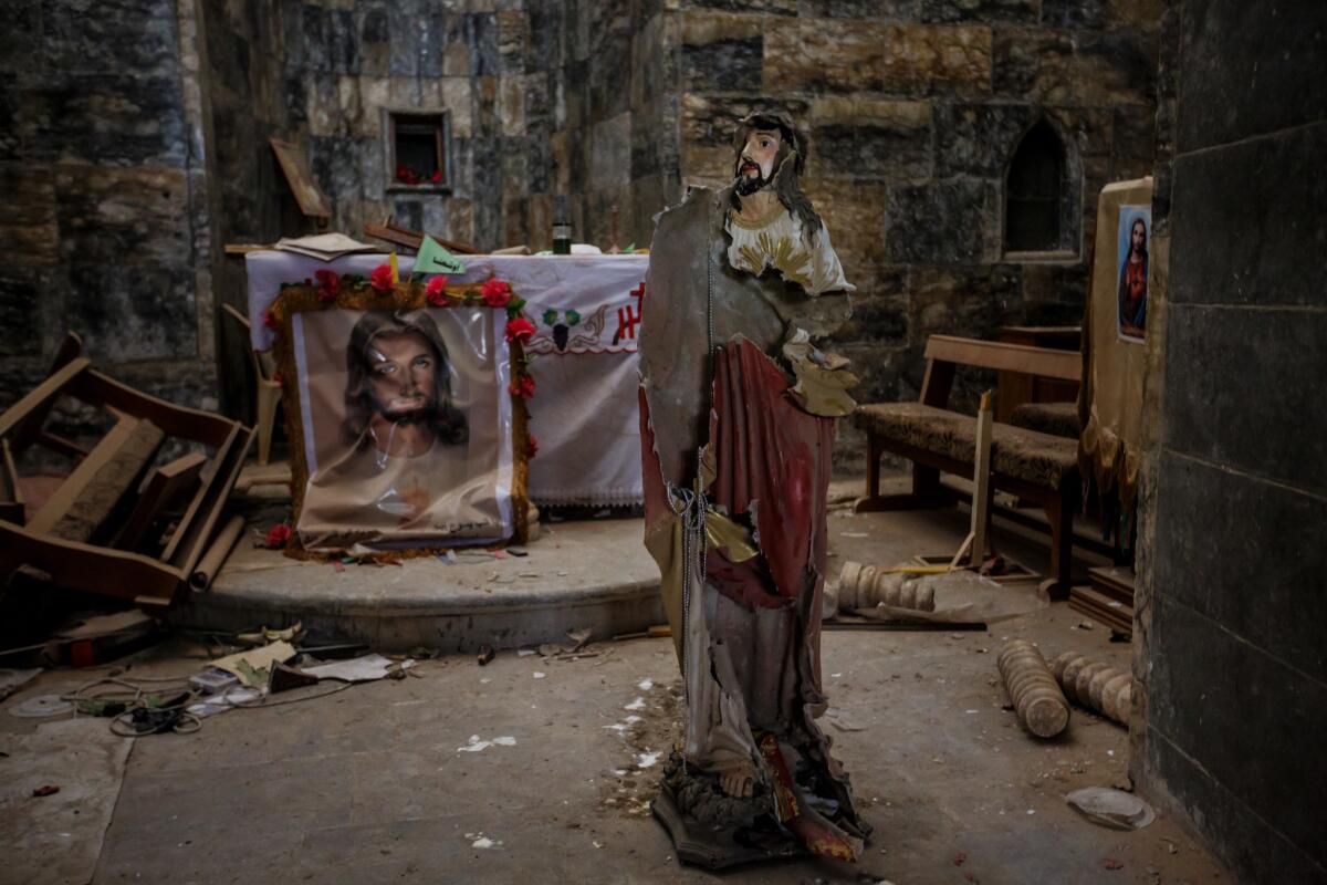 A prayer chamber is destroyed at St Mary Tahira in Qaraqosh, Iraq, where Islamic State militants took over it and used the courtyard as a firing range.