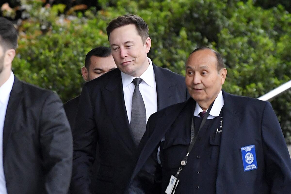 Elon Musk arrives at court