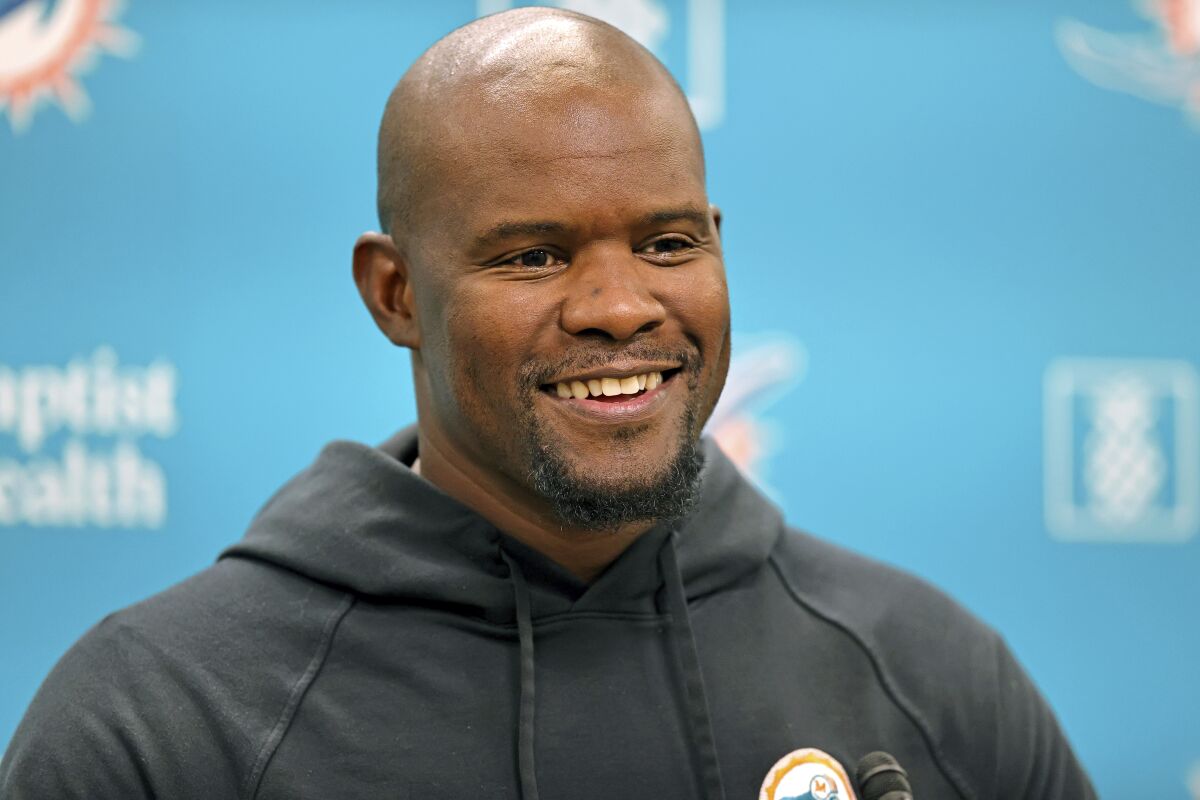 Miami Dolphins head coach Brian Flores talks to the media before an NFL football practice at Baptist Health Training Complex in Hard Rock Stadium on Wednesday, Oct. 6, 2021, in Miami Gardens, Fla. The Dolphins play the Tampa Bay Buccaneers on Sunday in Tampa, Fla. (David Santiago/Miami Herald via AP)