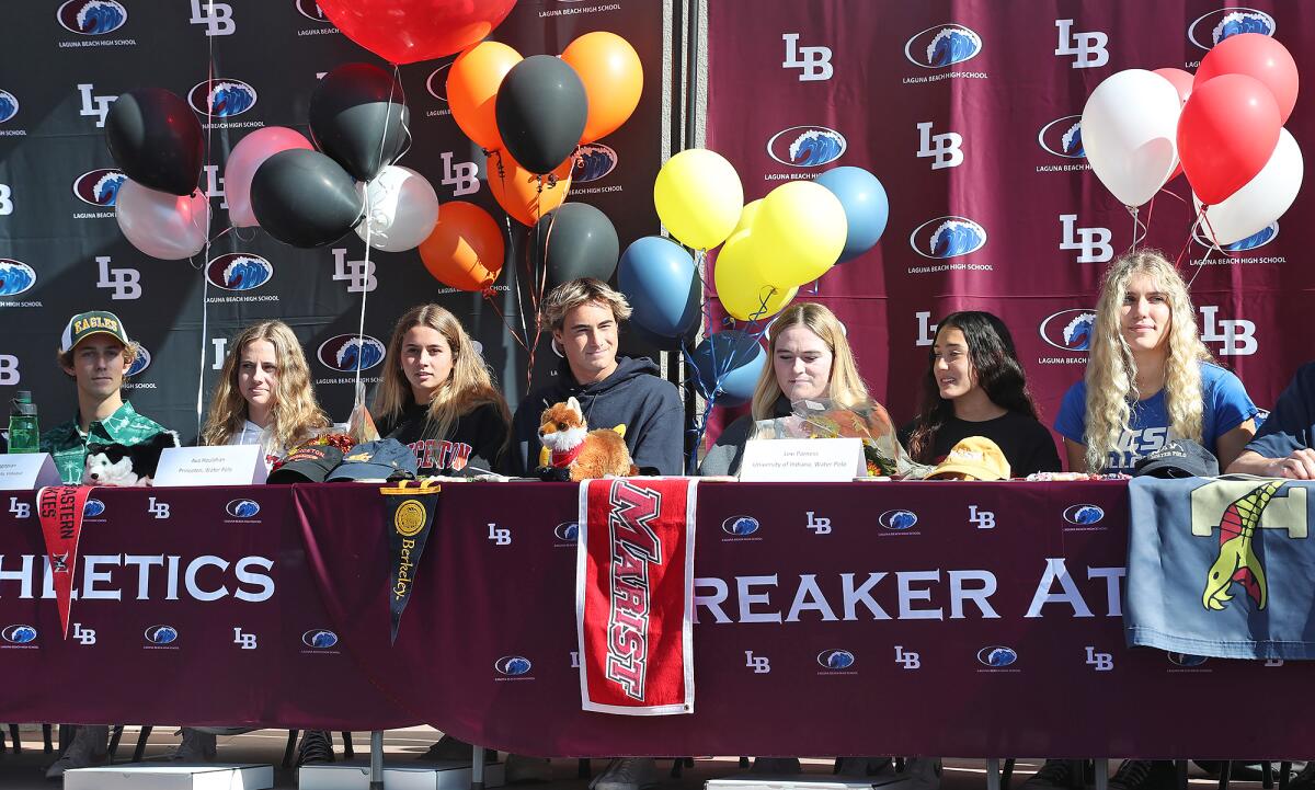 Laguna Beach athletes sign their letters of intent during a signing day ceremony with staff and parents on Wednesday.