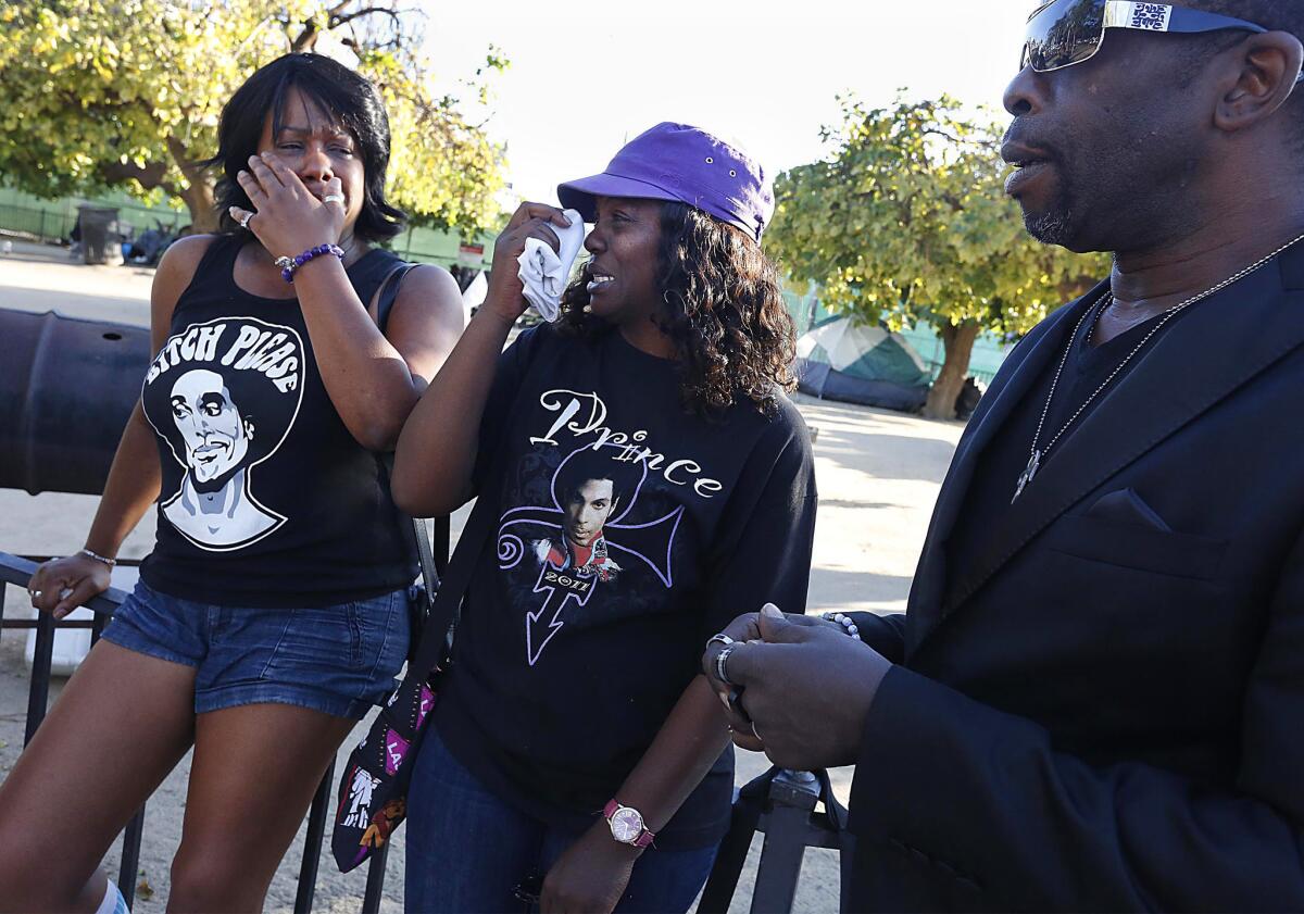 People get emotional while talking about Prince at a memorial for the artist in Leimert Park.