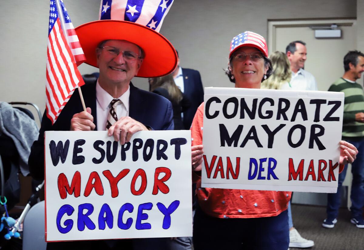 Huntington Beach residents Russell Neal and Kathy Neal show their support for Gracey Van Der Mark Tuesday.
