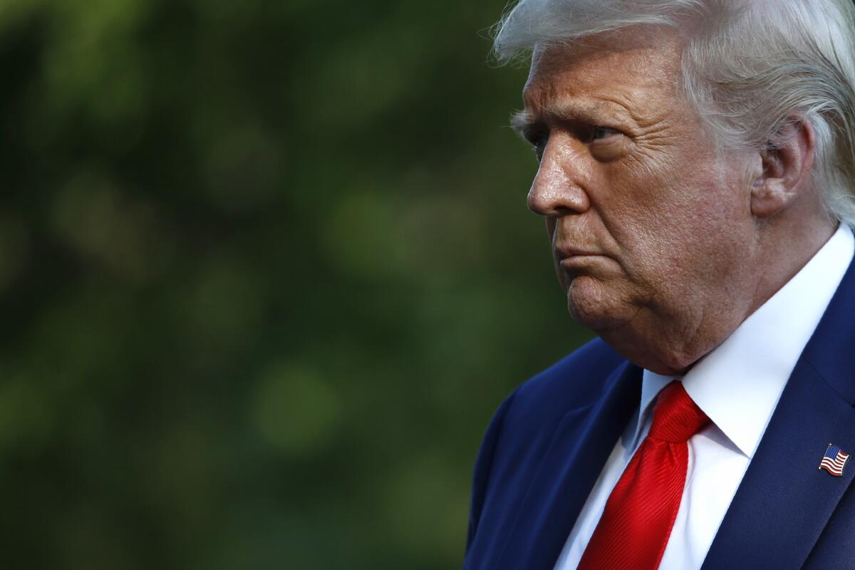 President Trump walks on the South Lawn of the White House. 