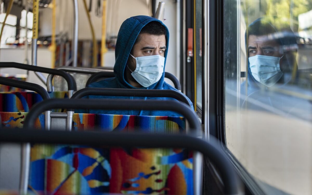 L.A. Metro passenger Danny Armada rides an Orange Line bus in Woodland Hills March 27. 