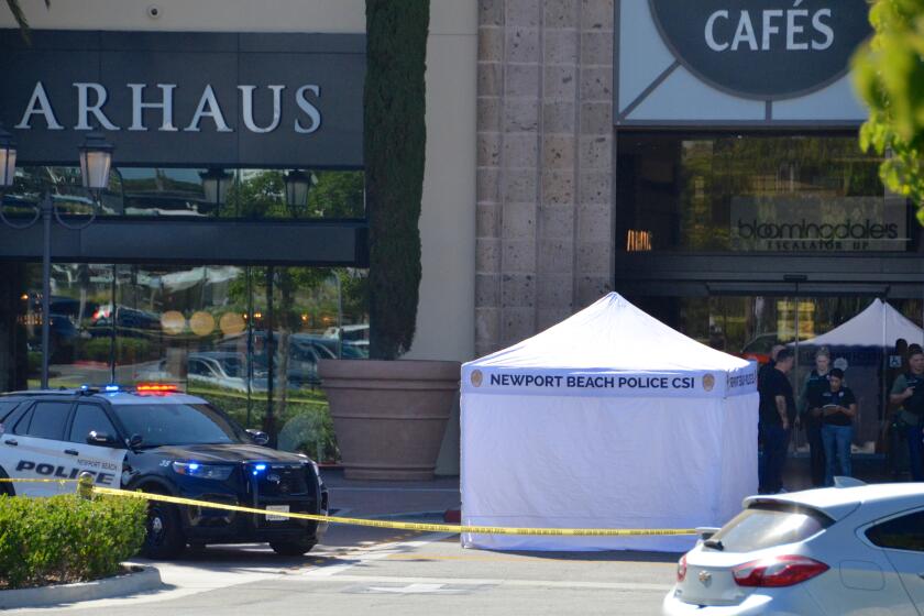 A white tent was set up nearby the Bloomingdale's at Fashion Island on Tuesday afternoon as Newport Beach police investigated a shooting.