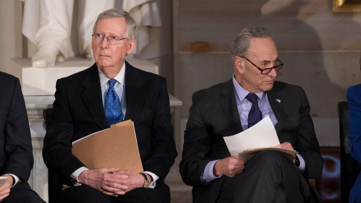 Senate Majority Leader Mitch McConnell, R-Ky., left, and Senate Minority Leader Chuck Schumer, D-N.Y., sit together at the Capitol in Washington, D.C., on Jan. 17.