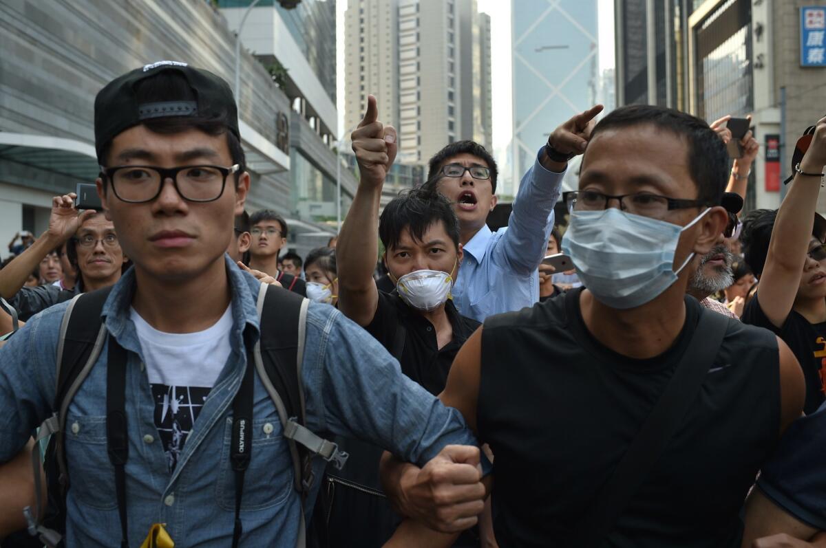 Pro-democracy protesters confront counter-demonstrators in Hong Kong's Admiralty district Oct. 13.