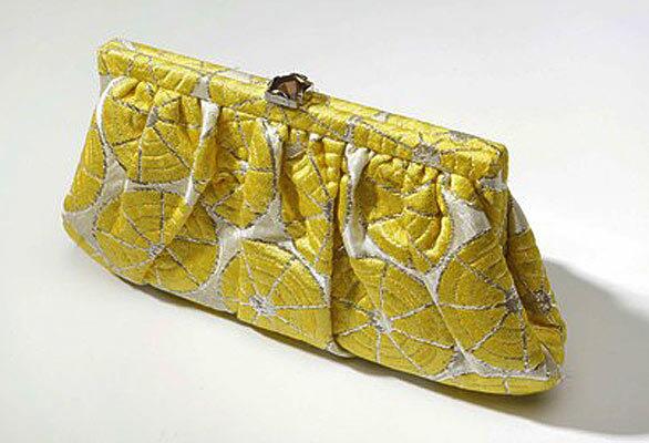 A yellow Kotur hand bag.