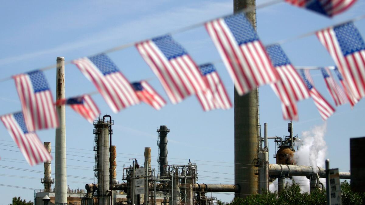 American flags fly near the Shell refinery in Martinez, Calif.