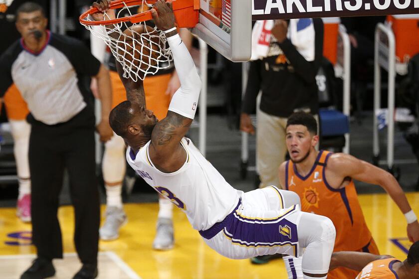 LOS ANGELES, CA - MAY 30: Los Angeles Lakers forward LeBron James (23) celebrates after slam dunking the ball in a game against the Phoenix Suns in the second quarter at the Staples Center on Sunday, May 30, 2021 in Los Angeles, CA. Game four of the NBA Western Conference first-round playoff series. (Gary Coronado / Los Angeles Times)