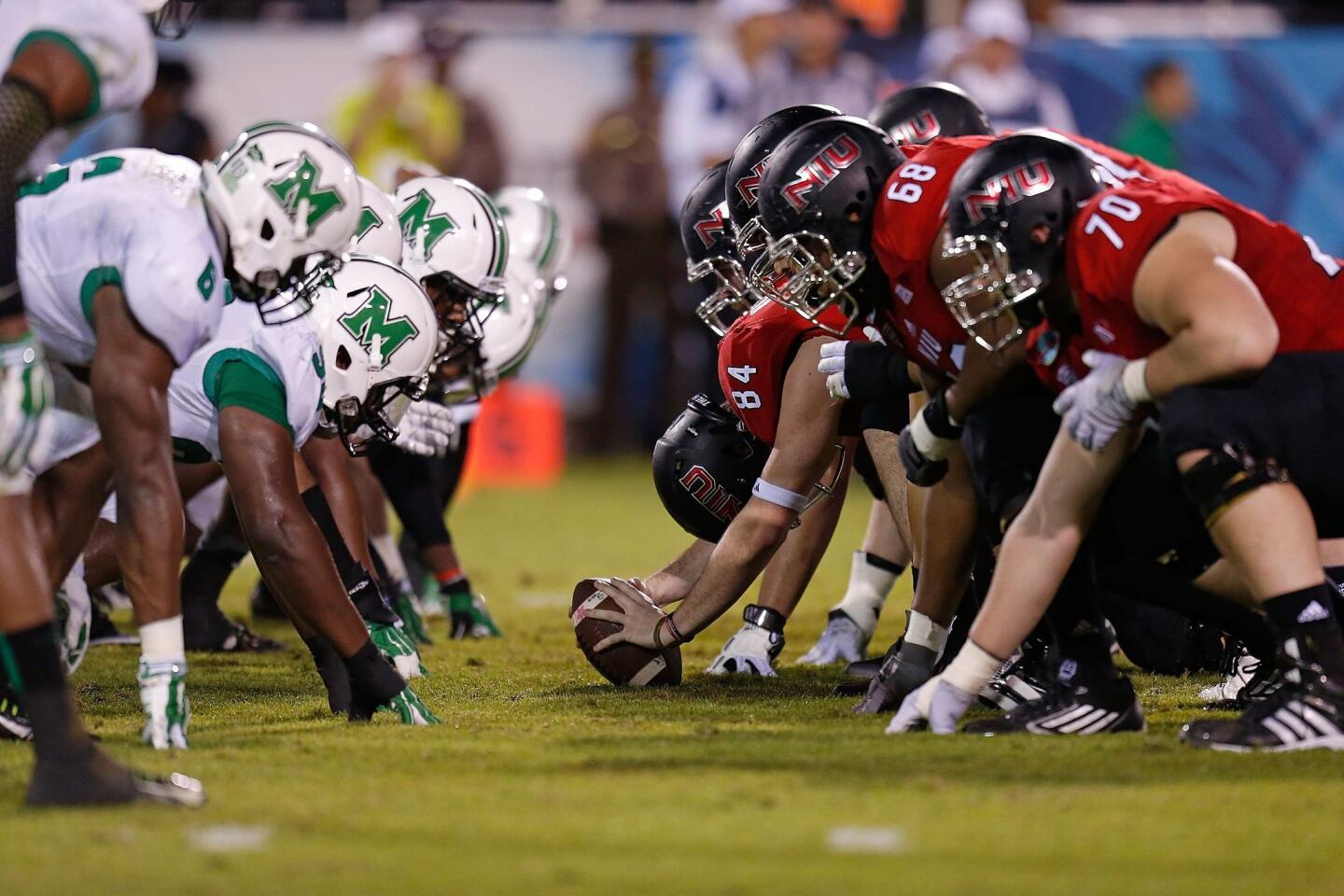 Marshall and Northern Illinois line up on the line of scrimmage.