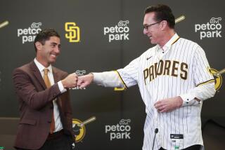 SAN DIEGO, CA - NOVEMBER 1: Padres general manager A. J. Preller fist bumps Bob Melvin, who was introduced as the Padres manager at Petco Park on Monday, Nov. 1, 2021 in San Diego, CA. (K.C. Alfred / The San Diego Union-Tribune)