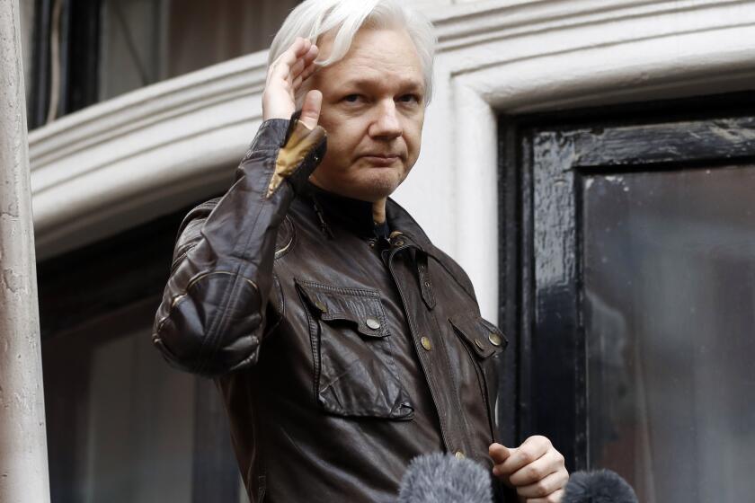 FILE - WikiLeaks founder Julian Assange greets supporters from a balcony of the Ecuadorian embassy in London, May 19, 2017. Britain’s top court on Monday March 14, 2022, refused WikiLeaks founder Julian Assange permission to appeal against a decision to extradite him to the U.S. to face spying charges. (AP Photo/Frank Augstein, File)