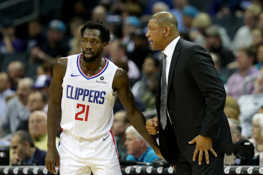 CHARLOTTE, NORTH CAROLINA - FEBRUARY 05: Head coach Doc Rivers of the LA Clippers talks to Patrick Beverley #21 of the LA Clippers during their game against the Charlotte Hornets at Spectrum Center on February 05, 2019 in Charlotte, North Carolina. NOTE TO USER: User expressly acknowledges and agrees that, by downloading and or using this photograph, User is consenting to the terms and conditions of the Getty Images License Agreement. (Photo by Streeter Lecka/Getty Images)