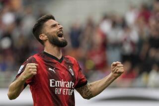 AC Milan's Olivier Giroud celebrates after scoring his side's third goal during a Serie A soccer match between AC Milan and Genoa, at the San Siro stadium in Milan, Italy, Sunday, May 5, 2024. (AP Photo/Luca Bruno)