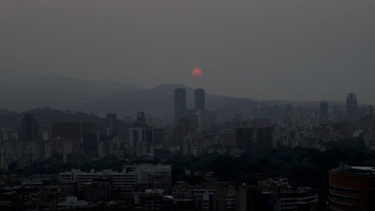 The sun sets over Caracas, Venezuela on March 26, 2019. Much of Venezuela remained without electricity Tuesday.