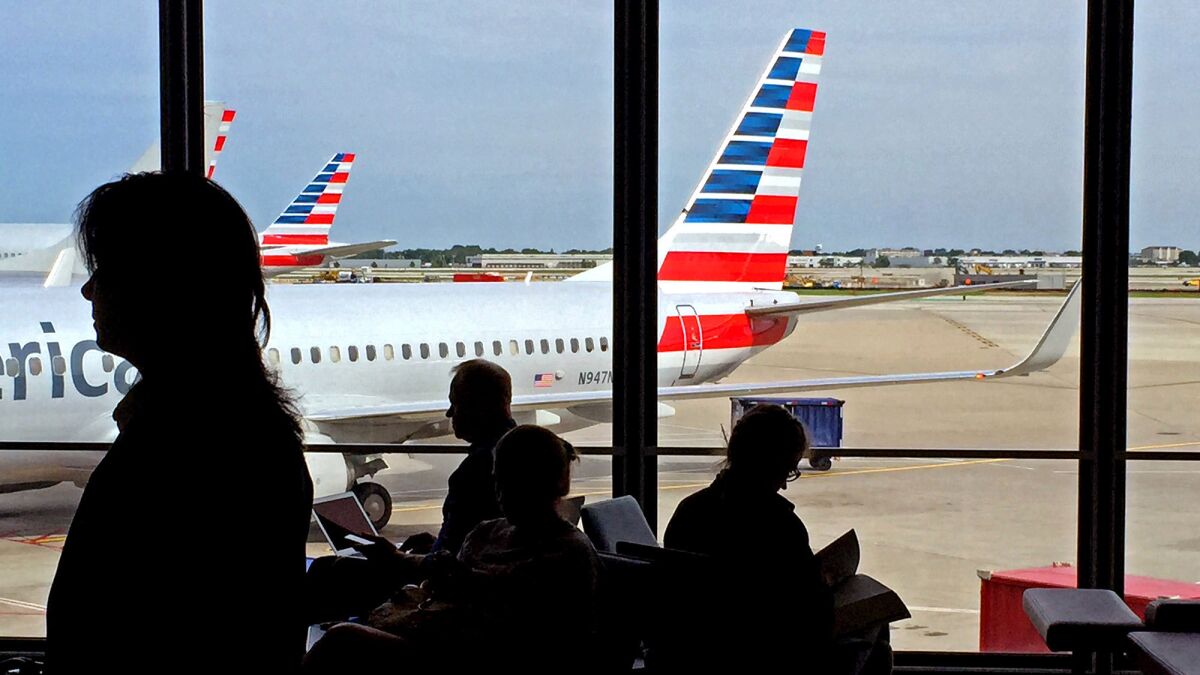 The average domestic airfare this fall is forecast to be $248, or 3.6% cheaper than in fall 2014. Above, travelers at Chicago O'Hare International Airport.