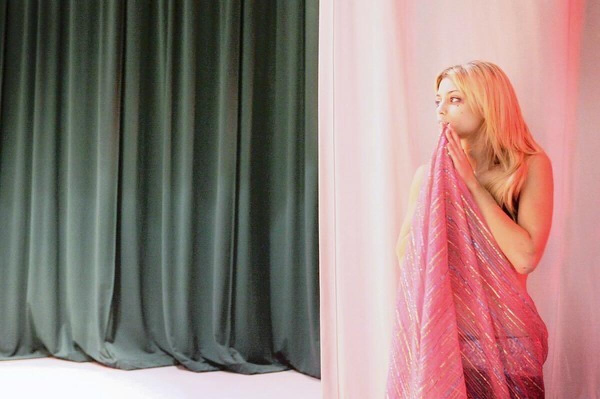 Lauren Jercan, 19, waits backstage before performing in front of friends and family during the Raks Sharqi dance class, a Middle Eastern dance form, which took place at Glendale Community College.