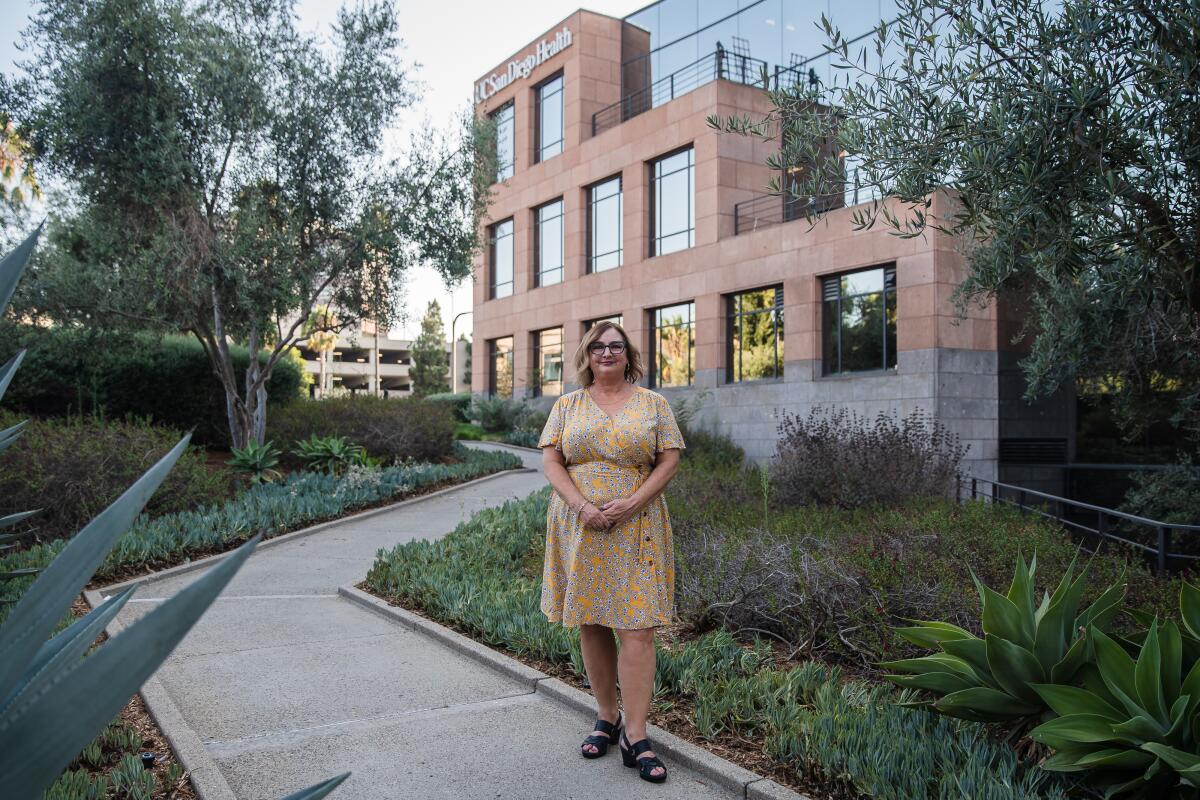 JD Oullette stands in front of the the UC San Diego Health Eating Disorders Center in La Jolla.