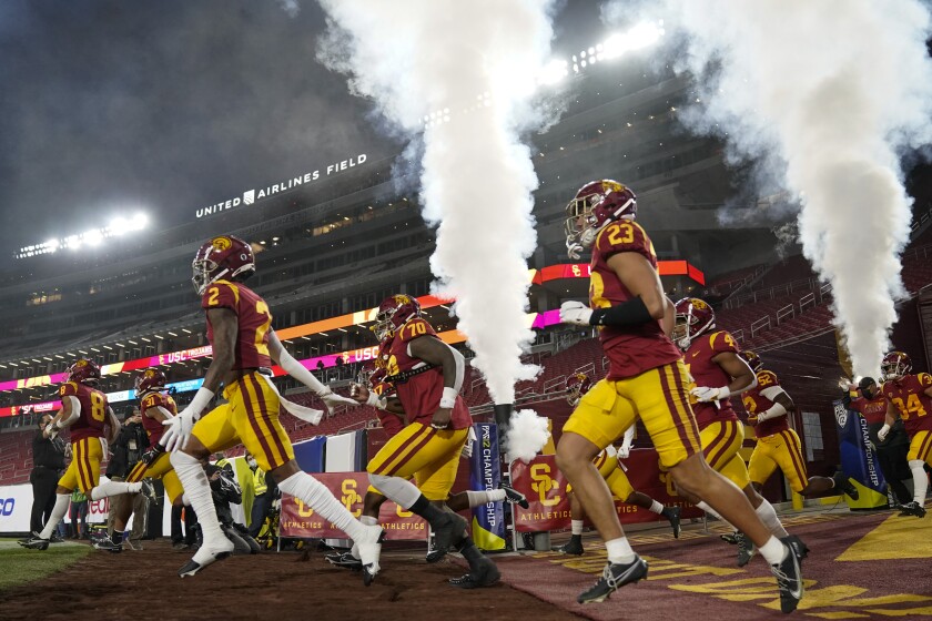 USC players enter the Coliseum before the Pac-12 title game against Oregon on Dec. 18, 2020, in Los Angeles.