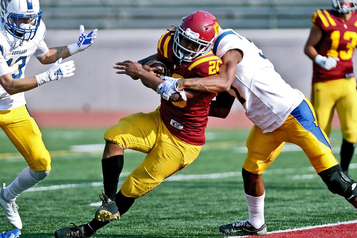Glendale Community College running-back Adayus Robertson pushed through the defense and scored a touchdown in game vs. Los Angeles Southwest College, at home in Glendale on Saturday, Nov, 10, 2018. Vaqueros won 47-20.