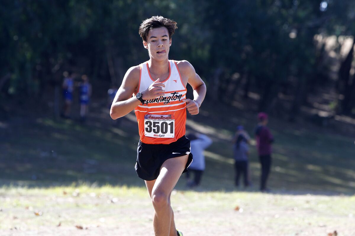 Huntington Beach's Jacob McQuirk competes in the Sunset Conference cross-country finals at Central Park on Saturday.