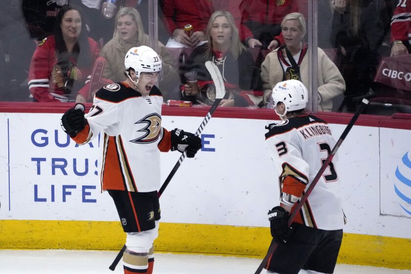 Anaheim Ducks' Frank Vatrano, left, celebrates his game winning goal with John Klingberg (3) during the overtime period of an NHL hockey game against the Chicago Blackhawks Tuesday, Feb. 7, 2023, in Chicago. The Ducks won 3-2. (AP Photo/Charles Rex Arbogast)